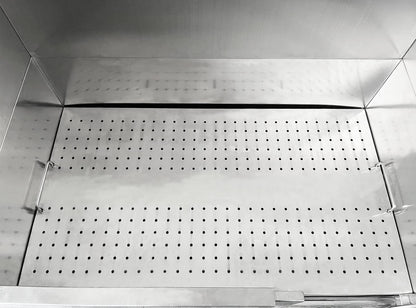 Perforated removable floor grate inside the stainless steel dog bath.