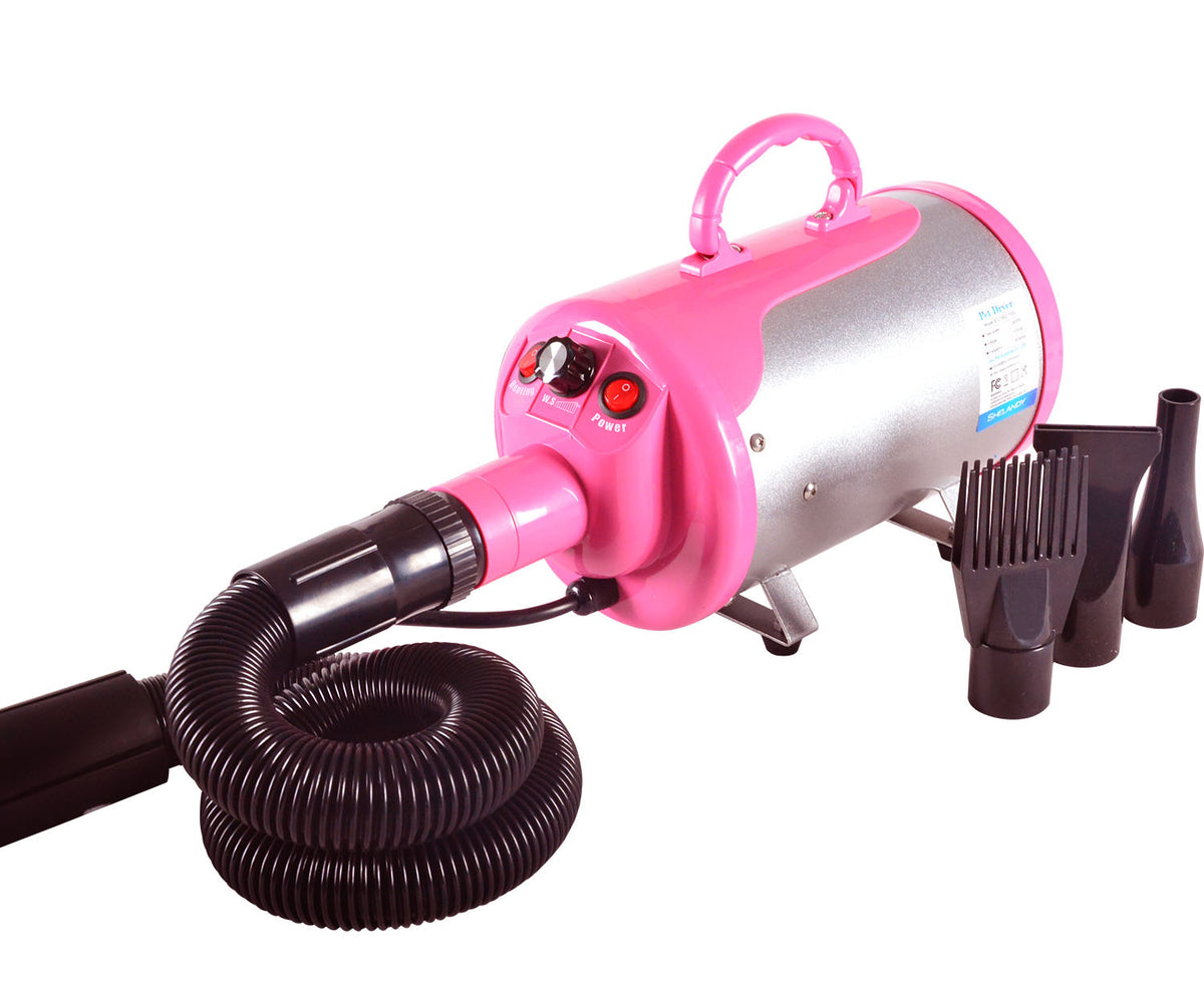 Pink Gravitis dog dryer with flexible hose and four nozzle attachments.