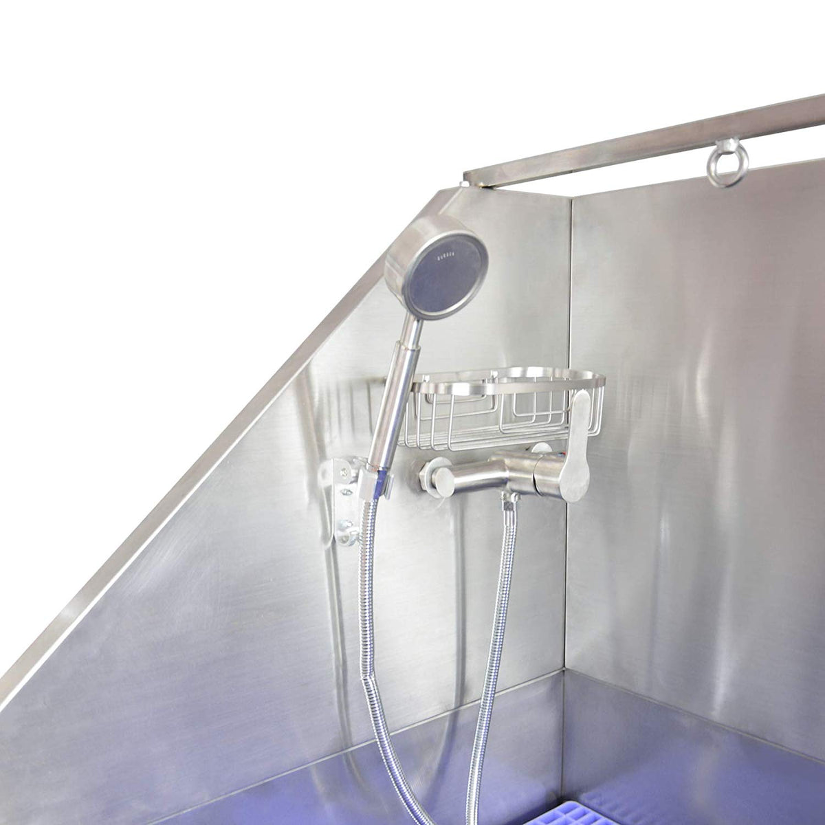 Inside the dog bath showing the mixer tap, handheld sprayer and storage basket.