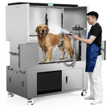 A groomer washing a dog in the SHELANDY Premium stainless steel dog wash station.