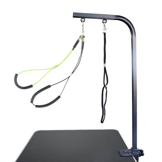 Black grooming arm clamped to a table with neck loop and padded haunch holder.